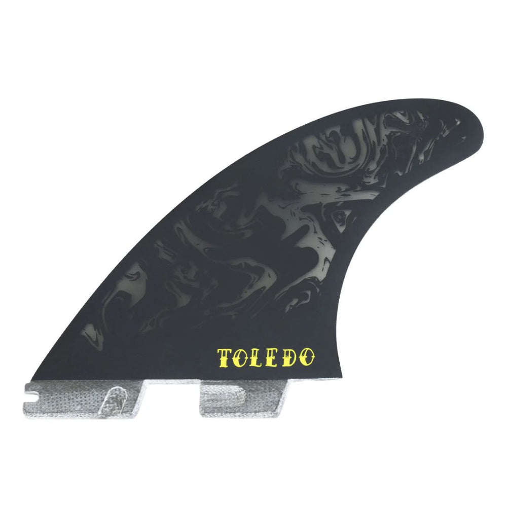 Black and yellow Toledo surfboard fin on a white background