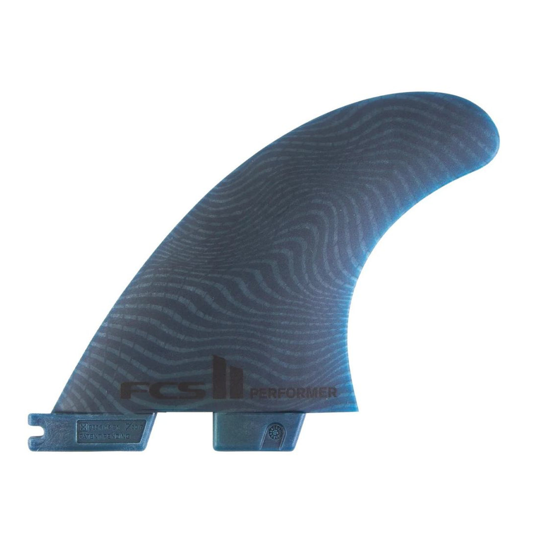 Blue surfboard fin with 'FCS II' branding on a white background