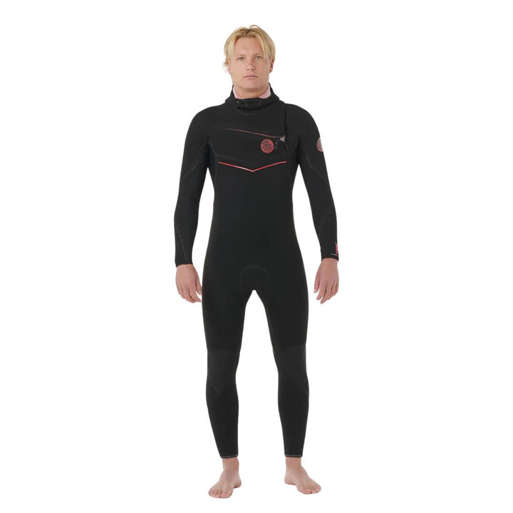 Person wearing a black wetsuit with red accents on a white background