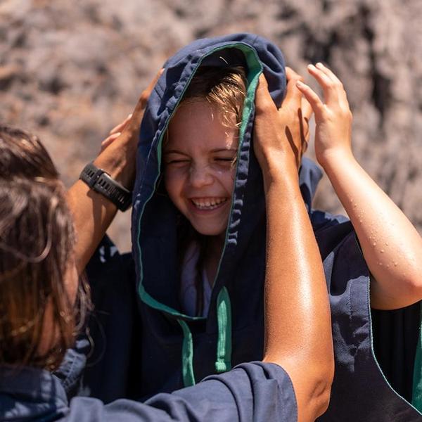 Lifestyle Photo of Red Original Kids Quick Dry Poncho