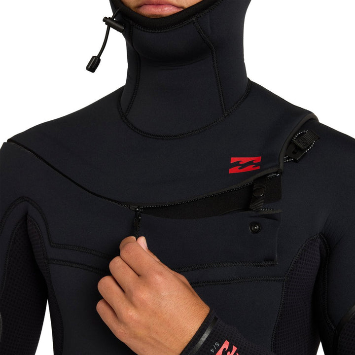 Opening the chest zip on the Billabong Absolute Ultra