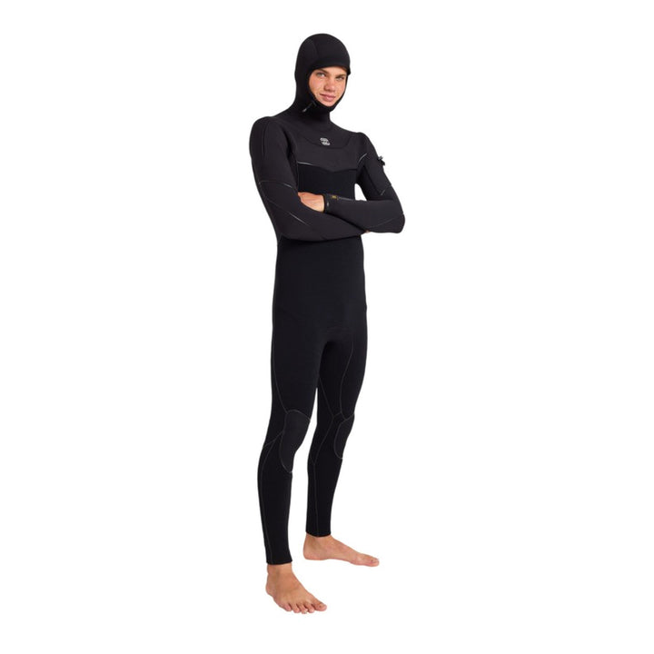 Surfer in the Billabong Furnace Ultra hooded wetsuit with arms crossed