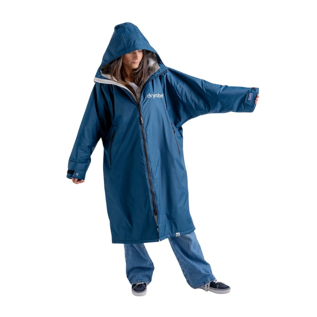 Person wearing a blue raincoat with a hood on a white background