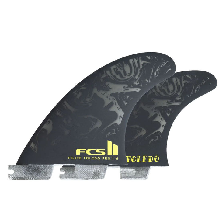 Two black surfboard fins with yellow branding on a white background