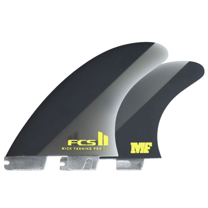 Two surfboard fins with FCS II and Mick Fanning logos on a white background