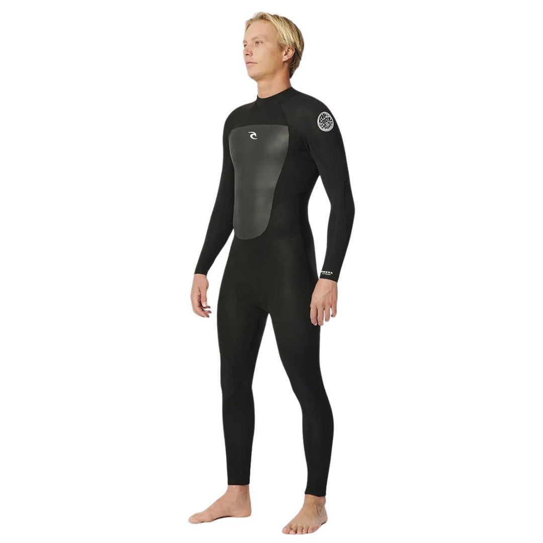 A male model wearing a black Rip Curl Omega 5/3 Back Zip Mens Wetsuit.
