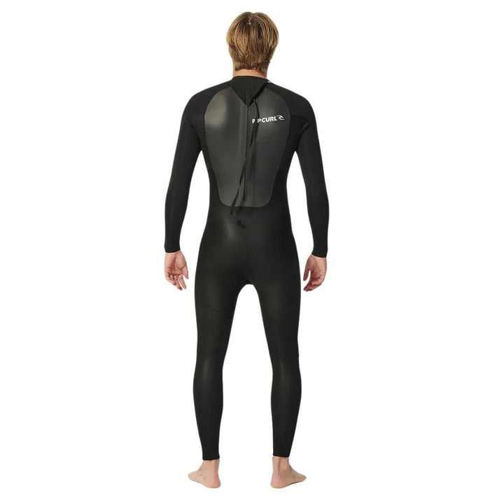 Model wearing black Rip Curl Omega 5mm mens wetsuit with a back zip. View of the back. 