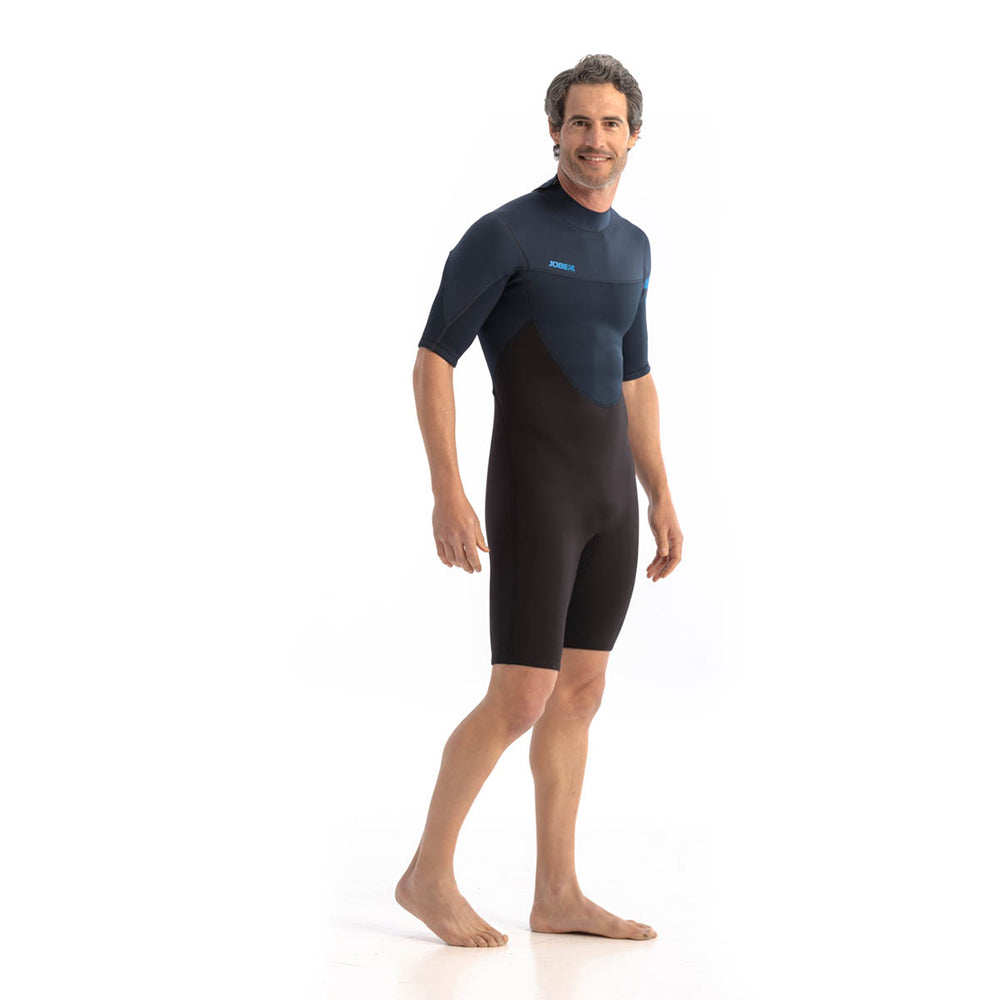 Male model wearing Jobe Perth 3mm Mens Shorty Wetsuit with a back zip entry. View of the front and side.  